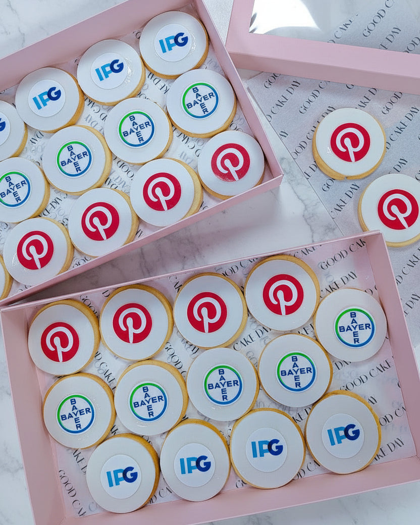 Cookies with various logos on a wooden surface