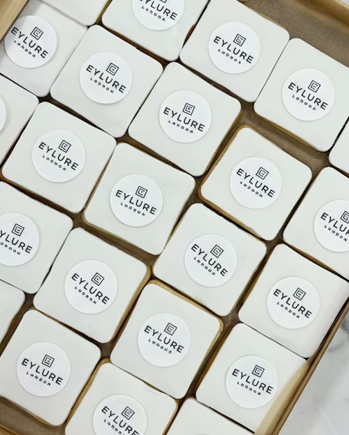 Square biscuits with Eylure logo on top 
